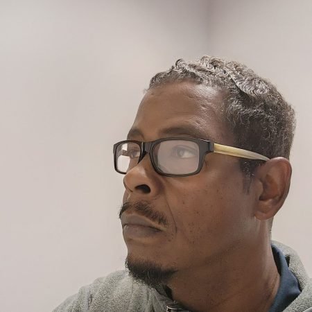 Headshot Picture of owner studying